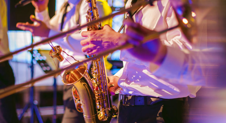 Musician plays the saxophone performance at a concert