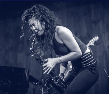 A woman playing sax