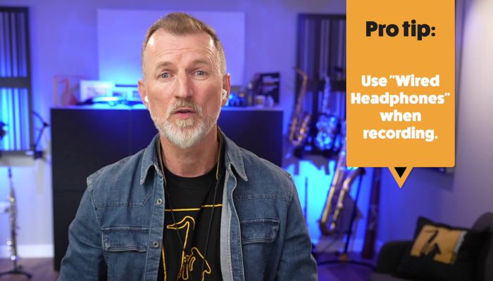 use wired headphones when recording to avoid latency. Sax School online