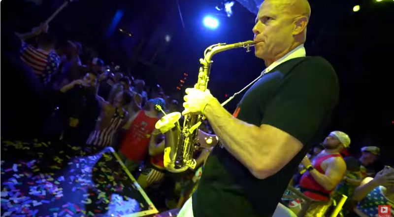 Jason Whitmore playing saxophone with a DJ. Sax School online podcast